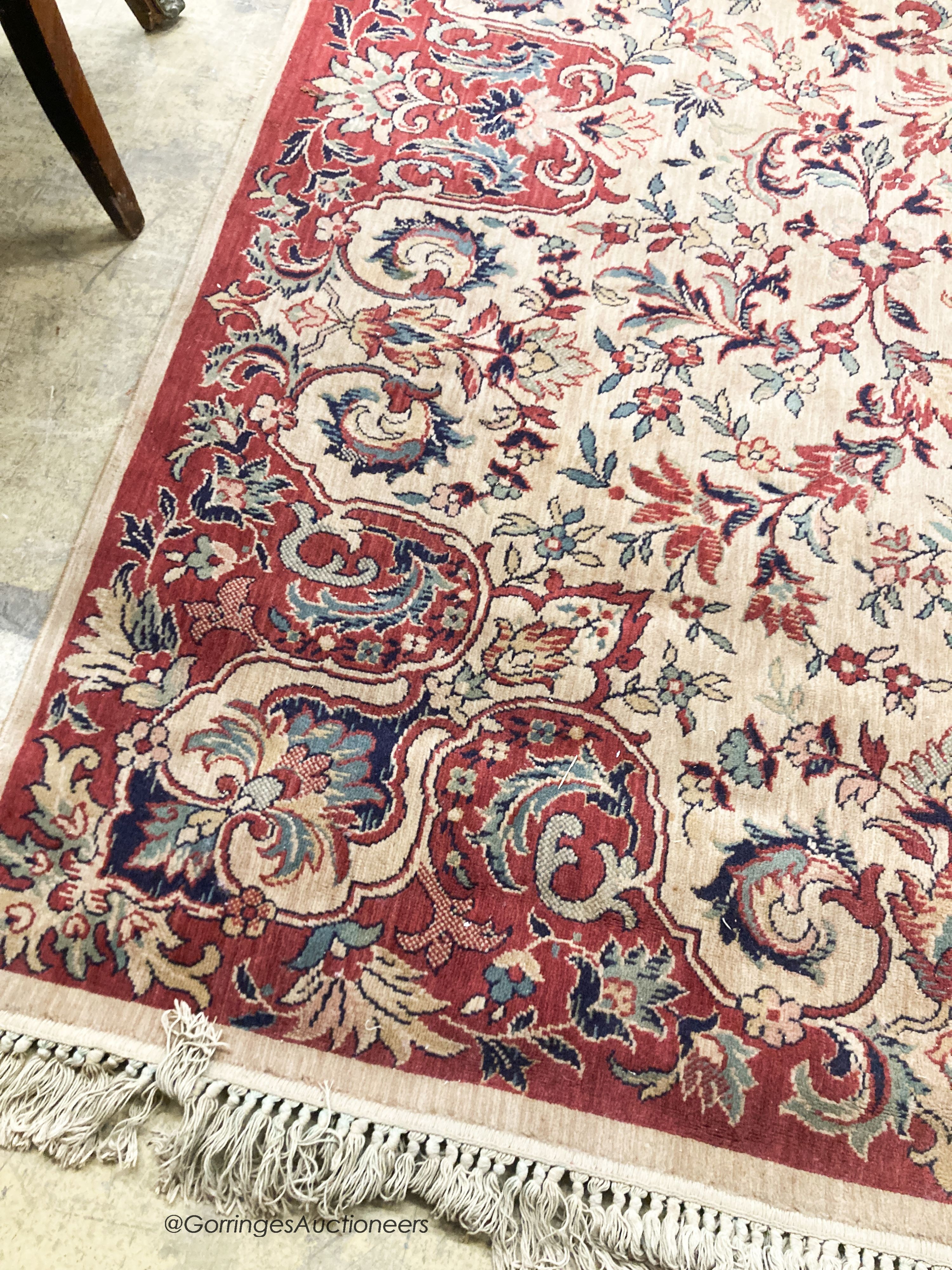 A Persian style ivory ground carpet, 380 x 280cm
